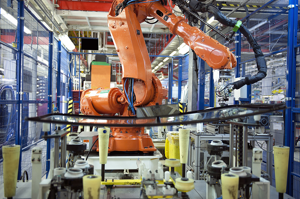 A traditional robot in a safety cage