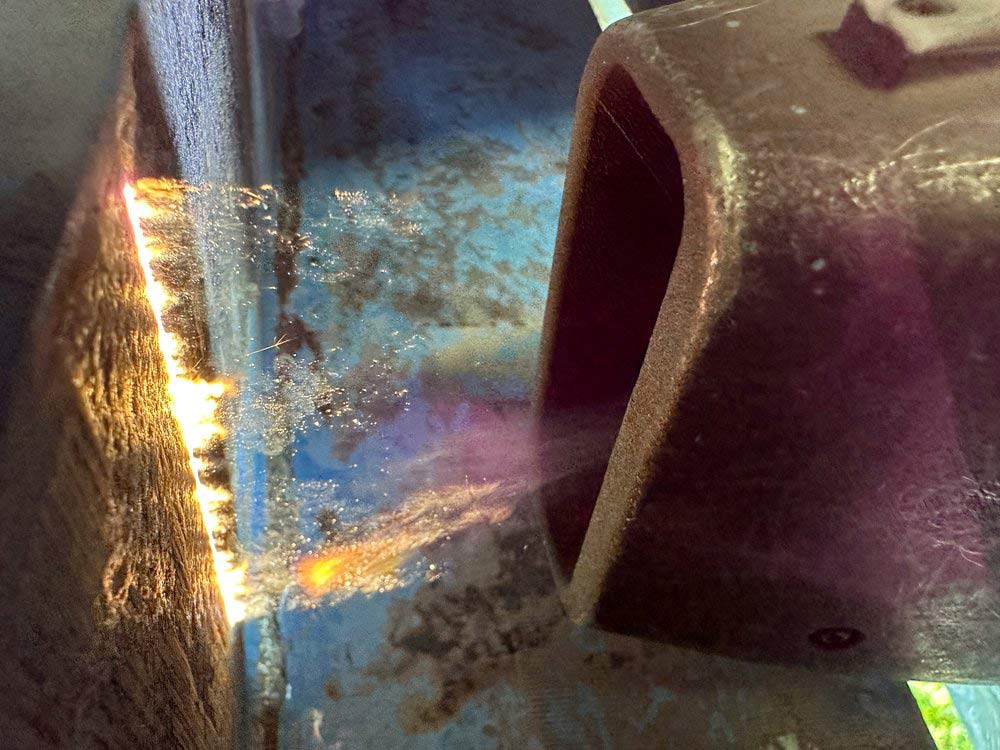 Closeup of laser cleaning used for bridge maintenance